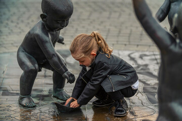 little girl playing in the square