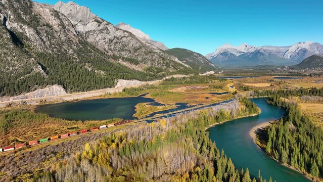 Drone view of a forest, rivers and mountains in the Rocky Mountains. Landscape from the air. Video for background. Fall view. Mountains and forest. Natural landscape. Banff National Park, Alberta, Can
