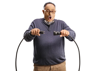 Scared mature man unplugging cables - obrazy, fototapety, plakaty