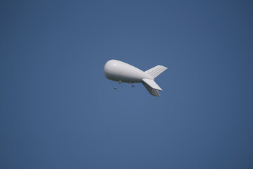 AIRSHIP - Flying object against the blue sky