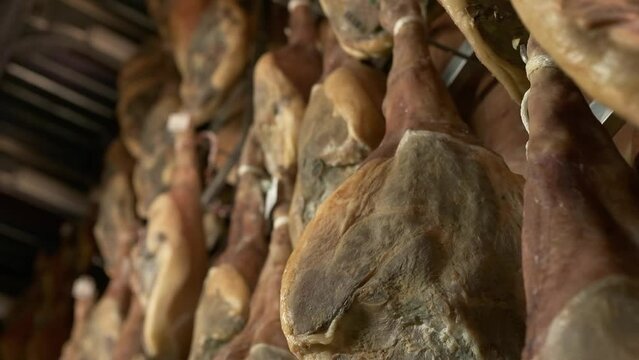 Jamon serrano pig legs factory hanging in a industry. Iberian ham elaboration process