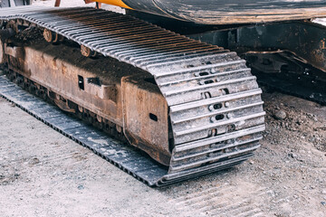 a heavy construction vehicle like a bulldozer showcases its robust machinery and steel tracks as it...