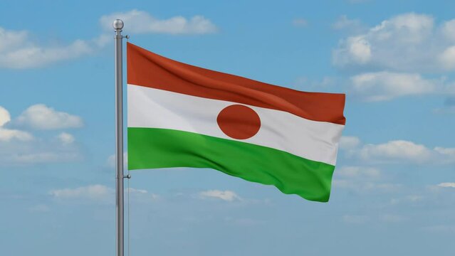 Niger looped flag waving in the wind with blue sky and running clouds, cycle seamless loop video