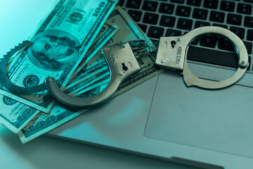 Police handcuffs in US dollars and euros.