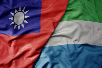 Fototapeta premium big waving national colorful flag of taiwan and national flag of sierra leone .