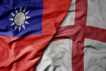 big waving national colorful flag of taiwan and national flag of england .
