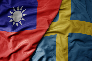 big waving national colorful flag of taiwan and national flag of sweden .