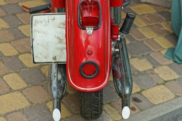 red rear fender iron shiny with red plastic round reflector rear wheel exhaust pipes and rear red...