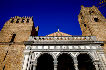Fototapeta na wymiar Santa Maria Nuova cathedral, Monreale, Sicily, Italy. Portal and Norman towers.