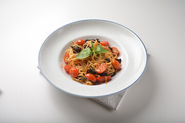 vegetarian sun dried tomato olive oil cook pasta noodle alio olio style in plate on white marble table western spaghetti cuisine halal food hotel luxury cafe menu