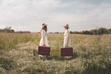 two surreal elegant women dressed alike with suitcase facing each other leave for their journey,...