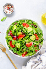 Healthy Vegetable Salad with Tomatoes, Arugula, Cucumbers and Onion, Diet Menu, Bright Background