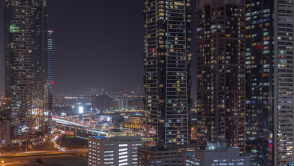 Business bay district skyline with modern architecture night timelapse from above.