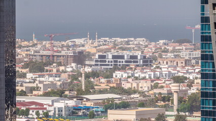 Naklejka premium Aerial view to Dubai City Walk district timelapse from above