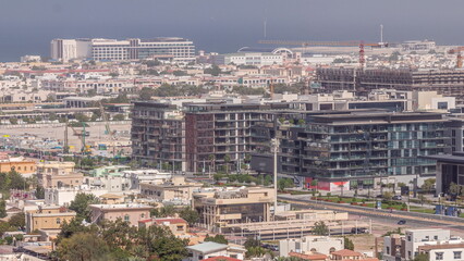 Naklejka premium Aerial view to Dubai City Walk district timelapse from above