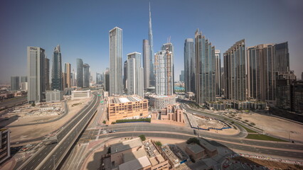 Aerial view of Dubai Downtown skyline with many towers all day timelapse.