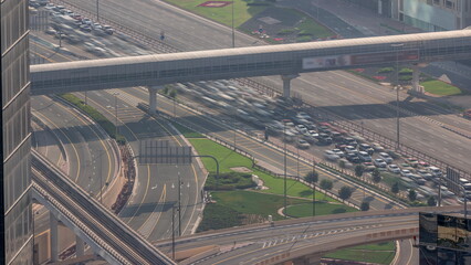 Aerial view from above to a busy road intersection in Dubai timelapse.