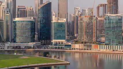 Fototapeta premium Aerial view to Dubai Business Bay and Downtown with the various skyscrapers and towers timelapse