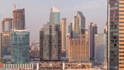 Aerial view to Dubai Business Bay and Downtown with the various skyscrapers and towers timelapse