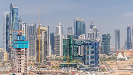 Cityscape with skyscrapers of Dubai Business Bay and water canal aerial timelapse.