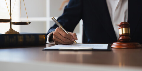 Close up lawyer businessman working in office workplace for consultant lawyer concep