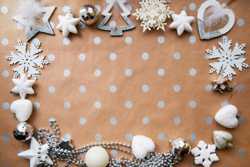 Obraz na płótnie Canvas Christmas silver frame: ornaments background, basic classic pattern, place for text. Trendy decorations: disco balls, snowflakes, fluffy ornaments. Aesthetic festive atmosphere. View from above