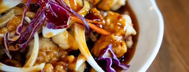 Poster Restaurant Delicious sweet and sour sauced deep fried pork, Tangsuyuk, with vegetables.  © RomixImage