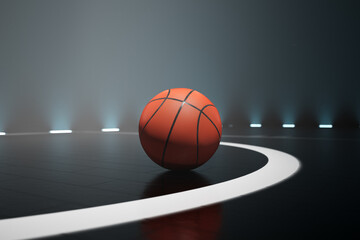 Close-up view at a ball on the black, foggy basketball court. Nightly scenery.