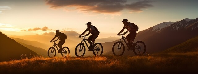 silhouette Three friends or athletes on electric bikes travel on vacation in beautiful mountains with a beautiful orange sunset.