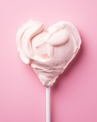 heart shaped pink ice cream on pink background.