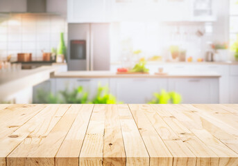 Selective focus.Wood table top on blur kitchen counter in morning background.For montage product...