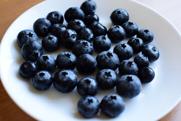 Blueberries on a white plate