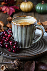 Still life with coffee cup on wooden background