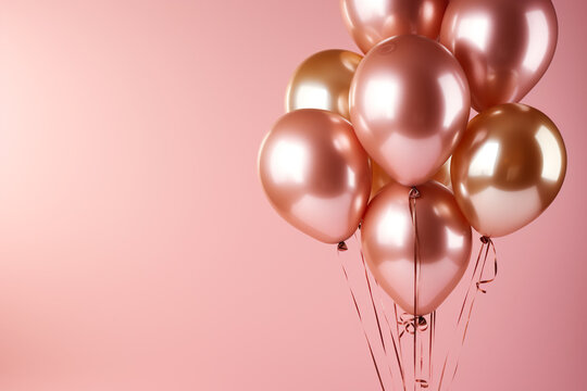 rose gold foil ballons on a pastel pink background card
