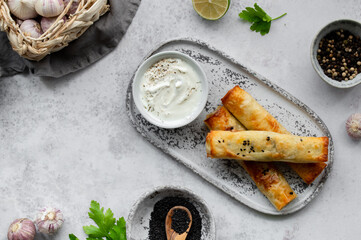 Turkish Cigara Börek (Sigara böreği) or Cigarette Pastry with Spinach and Feta Cheese with...