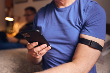 Man using smart watch to check heart rate and activity levels