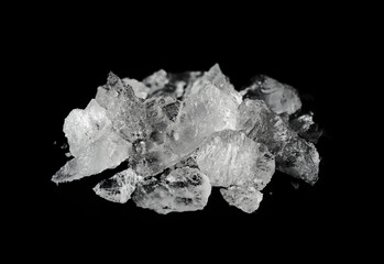 concept of ice drug crystal methamphetamine isolated on black background. pile of ice drug crystal...