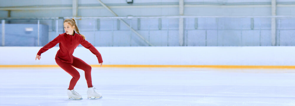 Talented and concentrated girl in red sportswear, figure skating athlete in motion, training on ice rink arena. Concept of professional sport, competition, sport school. Banner. Copy space for ad