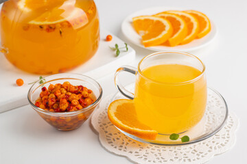 Sea buckthorn tea drink with oranges and mint. Autumn comfort hot drink. Herbal vitamin tea. 