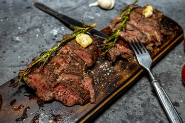 Grilled beef steak with red wine, herbs and spices
