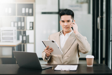 Fototapeta premium Mature business man executive manager looking at laptop watching online webinar training or having virtual meeting video conference doing market research working in office..