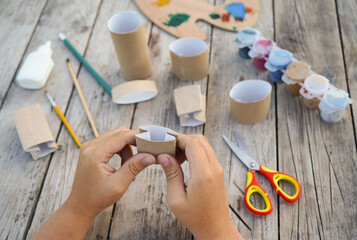 Kids craft bunnies out of recycling toilet paper roll, zero waste concept. Step by step instruction...
