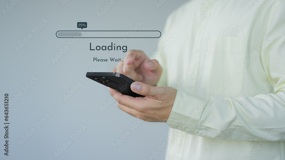 Poster Young man using a mobile phone for download and update application and waiting to loading digital file data form the apps, very slow internet form wifi. Concept of waiting for load of loading symbol.