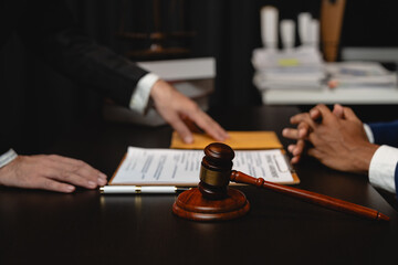 Businessman hands money envelope to lawyer in bribe over illegal business contract documents Investing, accepting bribes, corruption, fraud, unfairness, violation of ethics.