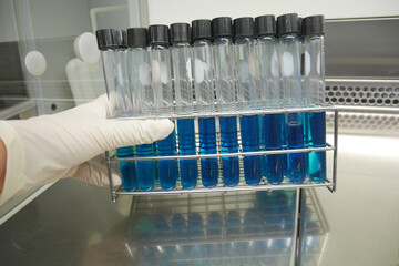 taking test tube with liquid, closeup. Laboratory analysis
