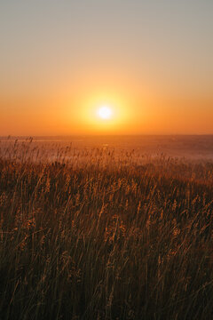 Sunrise over a field in Autumn
