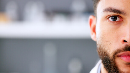Naklejka premium Face of serious young male in a high stress environment. Closeup of a business man head with a beard feeling anxious and stressed about work. Nervous office employee worried and looking forward.