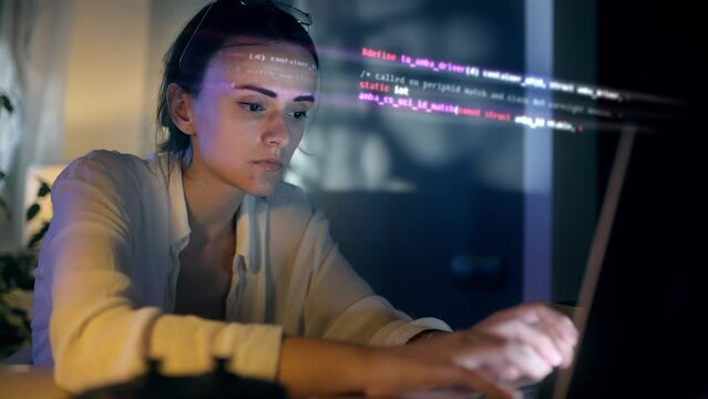 Portrait of Female Digital Entrepreneur Working on Computer. Line of Code Projected on His Face and Reflecting. App developer looking at hologram of machine learning data algorithm