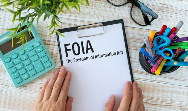 Paper with The Freedom of Information Act FOIA on a table