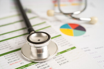 Stethoscope on spreadsheet and graph paper, Finance, Account, Statistics, Investment, Analytic research data economy and Business company concept.